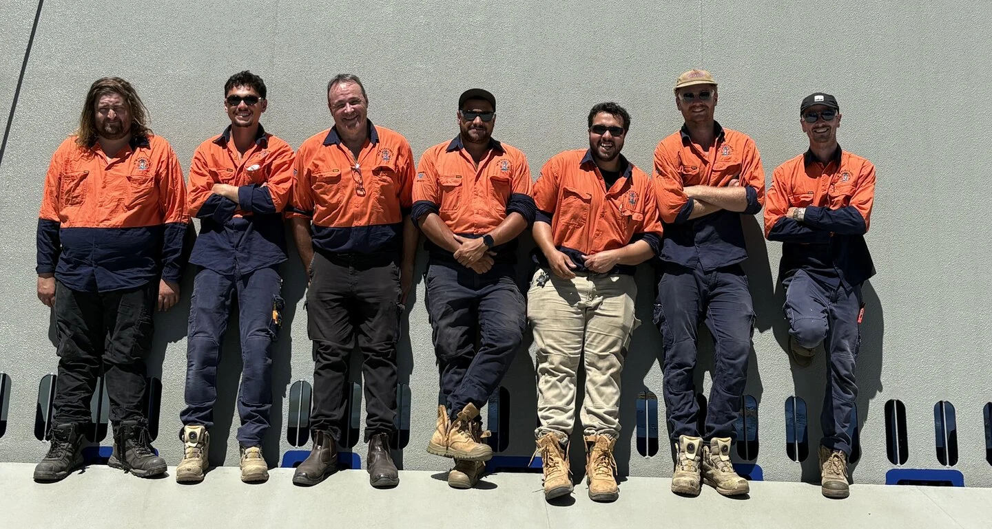 WTM Electrical team members together in work uniforms